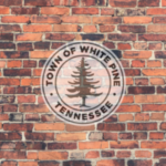White Pine Tennessee Town Seal on a brick background
