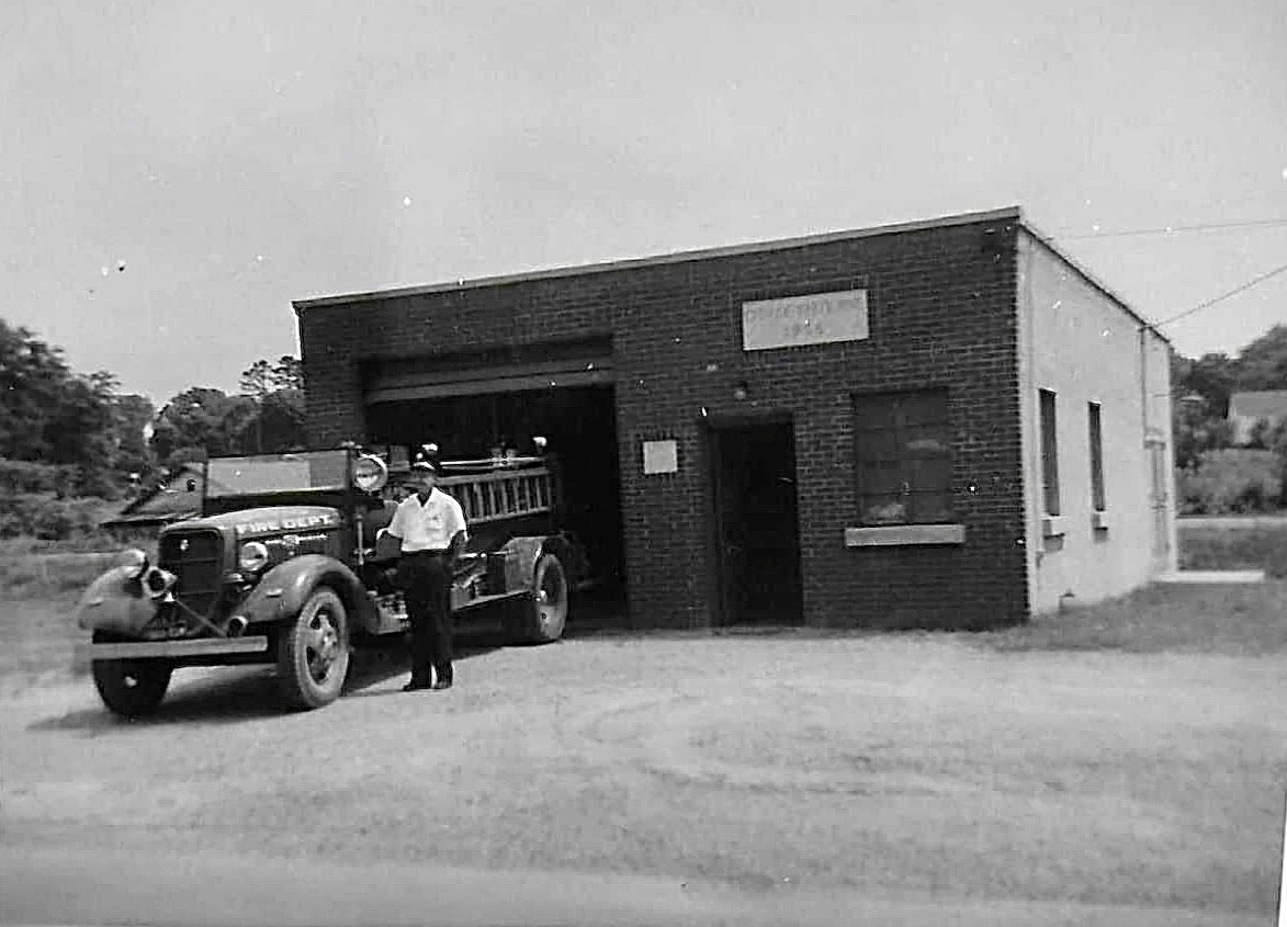 black and white photo of older white pine fire department