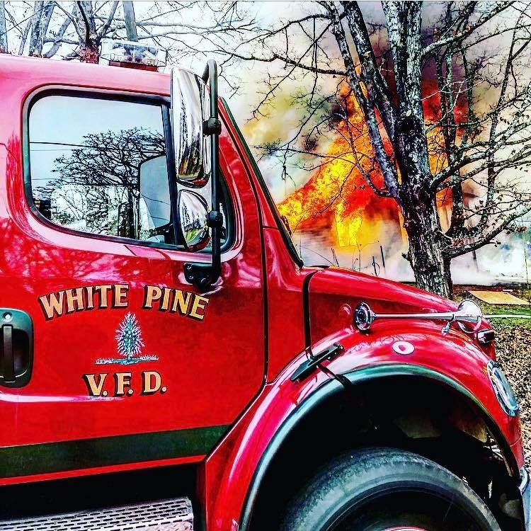 white pine fire department truck at a fire