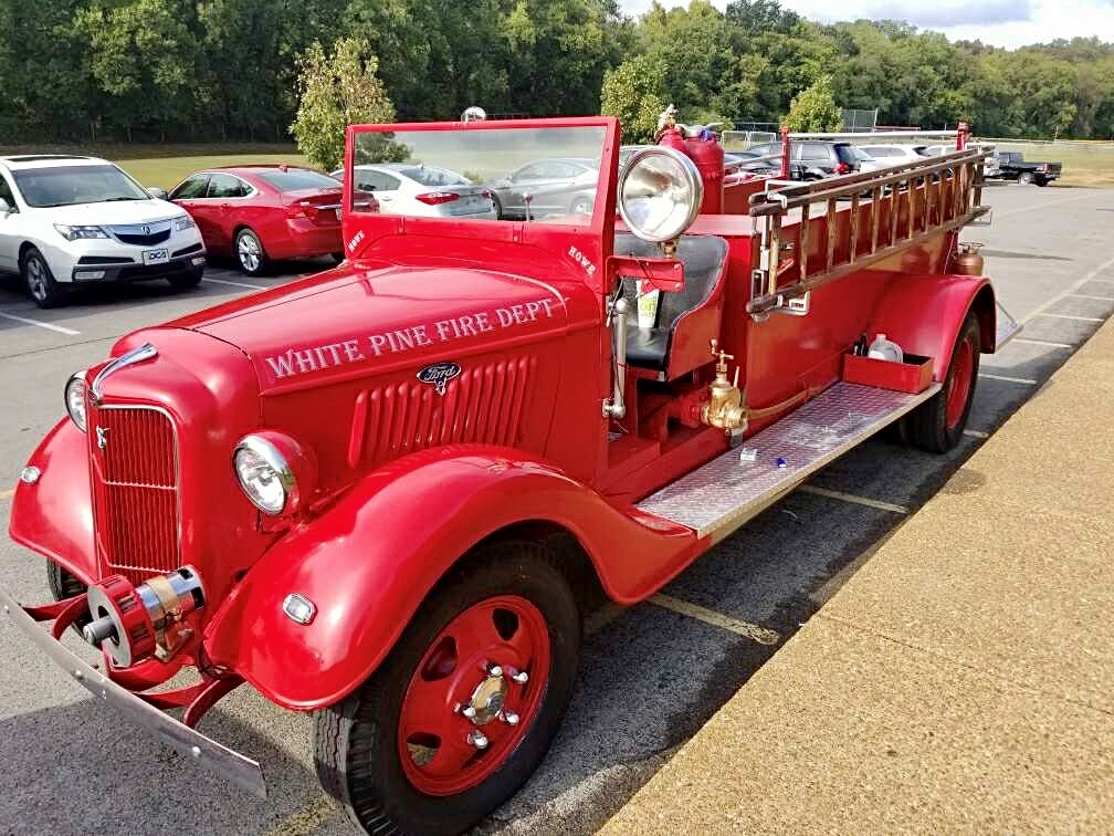 an original white pine fire truck from the old days